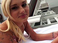 Blonde bombshell Charli Shiin is seductive blonde girl with slim sexy body shape. She is lying flat on her stomach sun bathing on a deck chair. Sexy blonde girl later plays with her pussy teasing the guy.