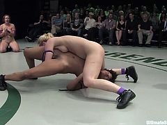 A bunch of slutty lesbian broads wrestle naked on the floor and the winner fucks the loser, check it out right here, it's hot.