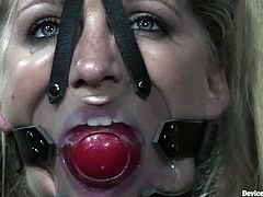 Kinky blonde bitch Dia Zerva allows some guy to restrain her in a basement. Then she gets her tits pinched and also gets her coochie pounded with a dildo.