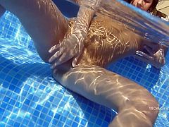 Lily was relaxing in the pool when she decided to strip off her sexy little bikini, pinch her nipples and rub her tender clit.