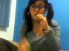 Kinky college girl sucks lolly pop and plays with her favorite dildo toy. Then she takes off her clothes and shakes her big juicy melons in front of a cam.