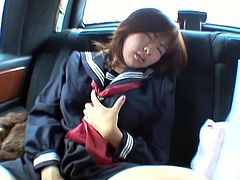 This Asian milf receives a pink egg vibrator, which she tries on while she's in a car. By the time the car arrives to the destination, she already has an orgasm.