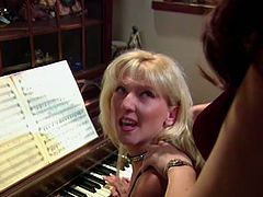 Blonde and brunette MILFs play the piano and then start to masturbate. They take their dresses off and finger shaved pussies as deep as they can.