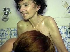 Tall and slender brunette teen helps her time worn granny to take a bath. Both bitches get naked and start playing with each other's tits.
