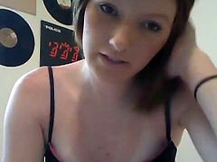 Attractive brunette girl takes off her bra flashing perky natural tits. She spits on her nipples and plays with her titties. Later on she plays with her snatch in front of camera.
