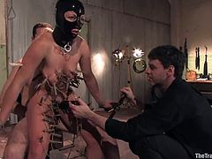 Blonde girl in mask gets tied up and suspended. After that she gets her pussy clothespinned and fucked hard.