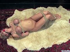 Sexy blonde girl with big boobs sucks big dick and gets tied up. Later on she gets her hot pussy toyed and fucked.