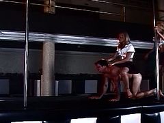 Anal injection threesome in the club with pole dancing trannies sharing horny stud.