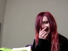 A shy redhead girl is given a huge sex toy and she doesn't know what to do with it. She blushes just by looking at it, but it's too big for her pussy.