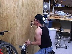 Stud sucking cock via glory hole