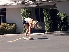 Have a blast watching this blonde doll, with gigantic knockers wearing shorts, while she exposes her curvy body outdoors in public.