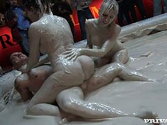 Pool is filled with warm mud. Terri Summers rides her partner's fat cock on top while her girlfriend strokes her big ass covered with all that mud.