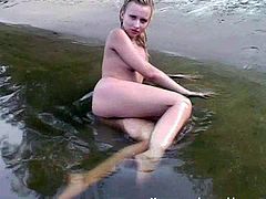 Press play to watch this Russian blonde, with born tits and a shaved pussy, while she walks naked at the beach, outdoors in public, in an amateur clip.