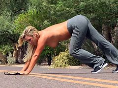 Cute blonde chick Embry is having some nice time outdoors. She jogs and then takes her pants and top off and demonstrates her big natural tits and shaved pussy.