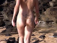 All natural Danielle shows her nude body on a beach