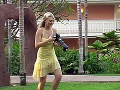 Take a nice look at this blonde girl, with big bazookas wearing a yellow dress, while she shows her intimate parts in a solo model video.
