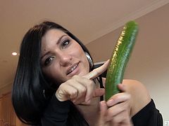 Sexy solo model masturbates in a kitchen. She rides a dildo sitting on a table. Marletta also uses a big cucumber as a toy.