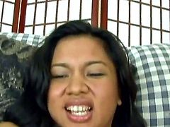 Nasty Asian chick Nakia Ty stimulates her hairy kitty rubbing it with vibrator and performs entrancing blowjob