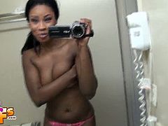 Tristan is in her bathroom and films herself in the mirror. She is topless, but she hides her big natural boobies with her hand. She holds her titties and talks.