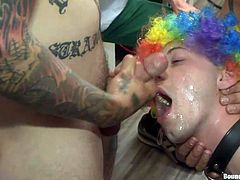 Because he always acted like the class clown, the boys gathered around him and treated Jace like one. The made him wear a clown wig, kept him down and his knees and roughly fucked his mouth. Jace received a lot of hard mouth fucking and cumloads. Look at him with his mouth opened, waiting for another load!