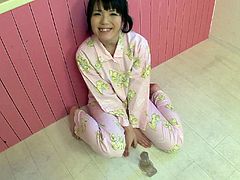 Naughty red haired asian filth Sena Sakura takes off her cute pink pijamas and fingerfucks her wet pussy in the kitchen.