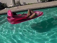 Young slender black haired slut Missy Maze with long pink nails and tight ass stretches her twat in backyard and goes in to pool to play with huge rubber dildo.