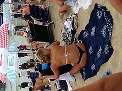 Blonde black thong on beach