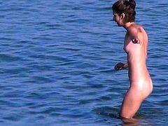 Nude babe doesn't know she is being watched by horny voyeur