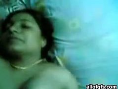 Filthy and fat bitch with huge ass and big stomach spreads her legs on the bed and tickles her clit. Have a look at this whore in The Indian Porn sex video.