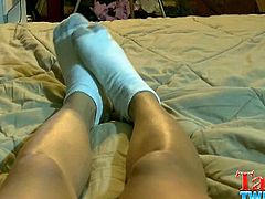 Angel is a twink with a foot fetish. He jerks off, keeping his feet close. He takes his white socks off at some point so that he can dump his load on his bare feet.