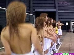 These Japanese babes play ball topless. In the same hall, a guy has a threesome with two hairy girls who suck him off and take his dick in front of everyone.
