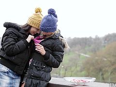 Share this with your friends! Two delightful girls, with natural boobs wearing winter clothes, touch and lick each other's pussies ardently.