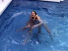 These two blonde teens fool around in the swimming pool. The real fun begins when they get out and start toying each others twats with a vibrator. They are both busty.