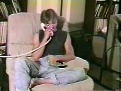 A kinky fair-haired dude is having some good time in the living room. He talks on the phone and then takes his weiner out of his pants and masturbates it.