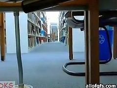 Pretty girl with small tits goes kinky in a public library. She flashes her tits while nobody sees her. She also slides her hand under her skirt. She fondles her coochie upskirt.