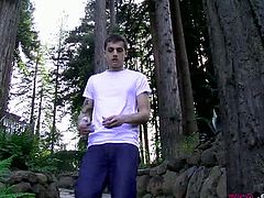 Make sure you don't miss this horny teen twink Chris Porter having some fun in the woods. Watch as she takes his pants of before stroking his cock like a real champ.