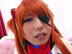 Ever wished to get in bed with an anime heroine? The Japanese babe in this video has orange dyed hair and has one eyes covered by a badge like a pirate. She's having fun playing dirty with a vibrator. The slutty chick gets down on her knees to suck a cock. Aren't you curious to see what's under her costume?