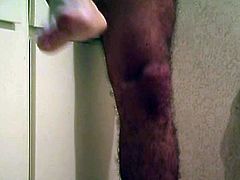 A hot dude is in the bathroom when he gets horny and wanks his big schlong before blowing his load in this free video.