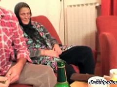 Nasty dark haired babe gives hot massage to this old stud. She makes him horny and helps his wife in satisfying his cock on the couch. The granny knows how to suck.