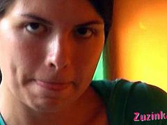 Zuzinka is a brunette exhibitionist. She plays with her pussy while sitting on a chair, in a public bar. She has no panties on, so she can easily finger herself.