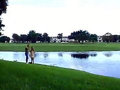 Brunette babe walks by the lake with her boyfriend. After this romantic time they have a wild sex. The girl lifts a dress up and gets fucked hard in her wet pussy.