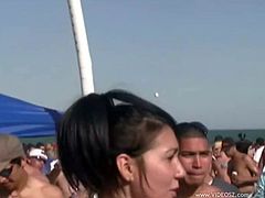Gorgeous curvy amateurs with long hair on the beach in sexy bikinis taking beer then gets aroused and grabs her lovely hot ass