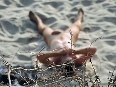 nudist touching himself on the beach
