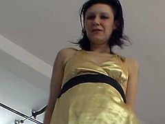 This Czech milf is wearing a golden babydoll while lap dancing. She rubs her pussy over the casting manager's crotch and she also strokes his cock a little.