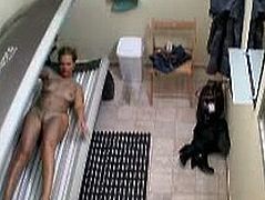 Blonde sweetheart tanning naked in solarium