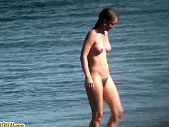 Sexy women of all ages can be seen on nudist beaches. They are minding their own business, taking baths in the sea and doing stuff on the beach completely naked.