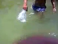 Indian girl in river with theri bfs
