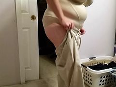 bbw wife squeezing into her girdle, putting on pants