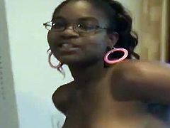 Slutty chocolate girl strips her clothes off in a bedroom. She shows her tits and pussy lying on a bed. Later on this slutty girl sucks a dick with pleasure.