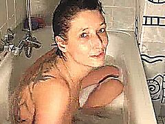 Amateur wife enjoys an intense fist fucking orgasm whilst soaking in the bath tub